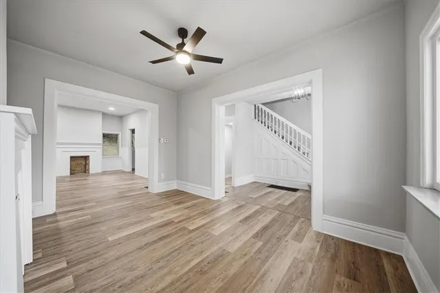 wooden floor in an empty room with a window