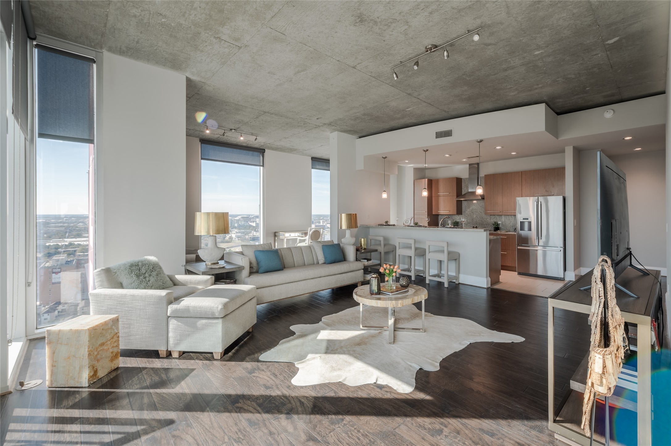 a living room with lots of furniture and a table