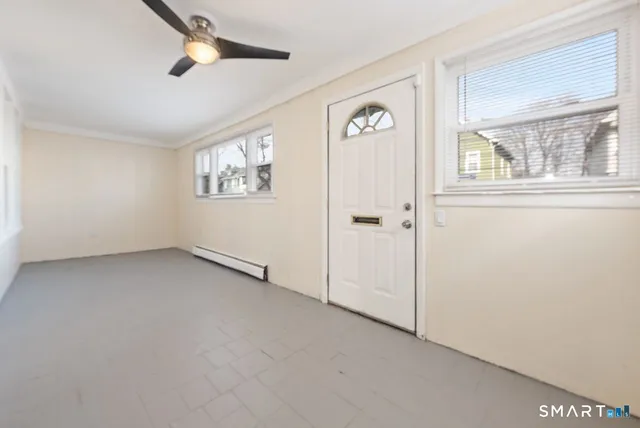a view of an empty room with a window