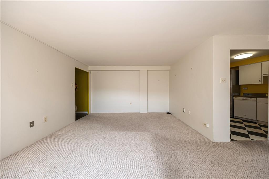 4625 Fifth Avenue, Unit 609 Pittsburgh, PA 15213 - Photo 12 of 27 an empty room with kitchen view