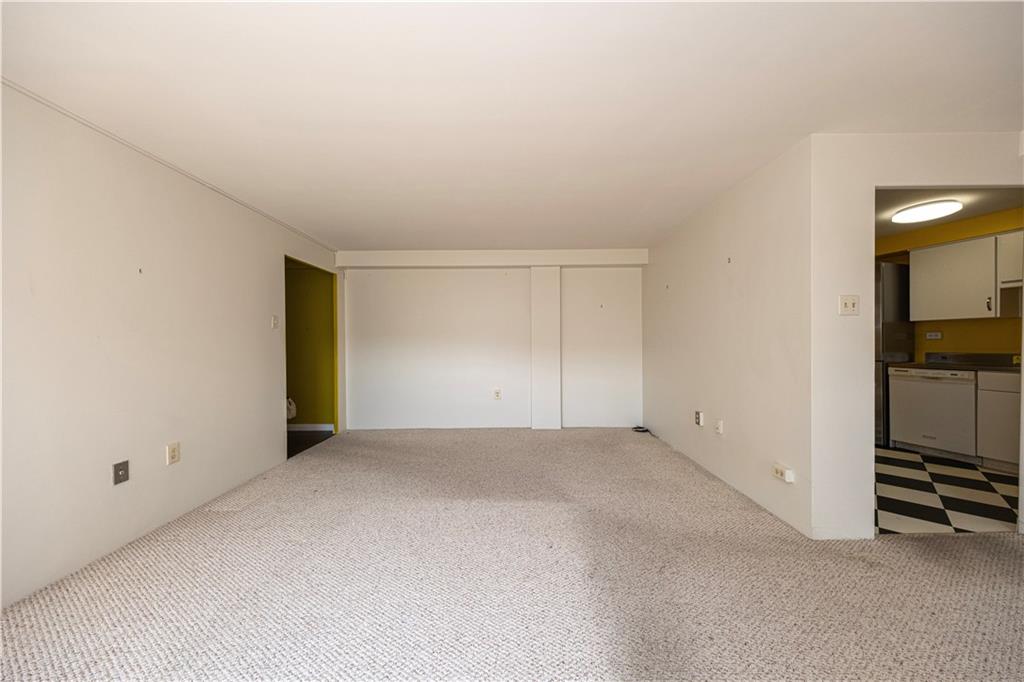 4625 Fifth Avenue, Unit 609 Pittsburgh, PA 15213 - Photo 16 of 27 an empty room with kitchen view