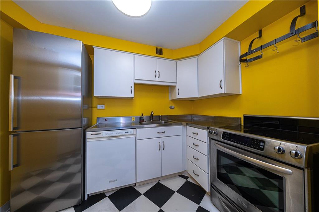4625 Fifth Avenue, Unit 609 Pittsburgh, PA 15213 - Photo 17 of 27 a kitchen with a sink appliances and cabinets