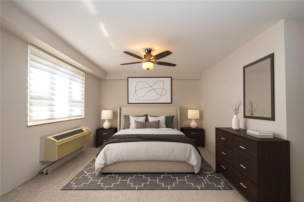 4625 Fifth Avenue, Unit 609 Pittsburgh, PA 15213 - Photo 22 of 27 a bedroom with a bed and window