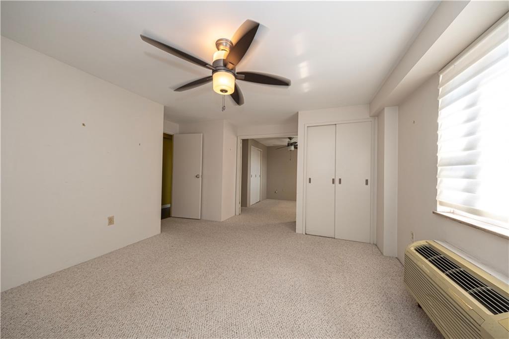 4625 Fifth Avenue, Unit 609 Pittsburgh, PA 15213 - Photo 24 of 27 an empty room with windows and fan