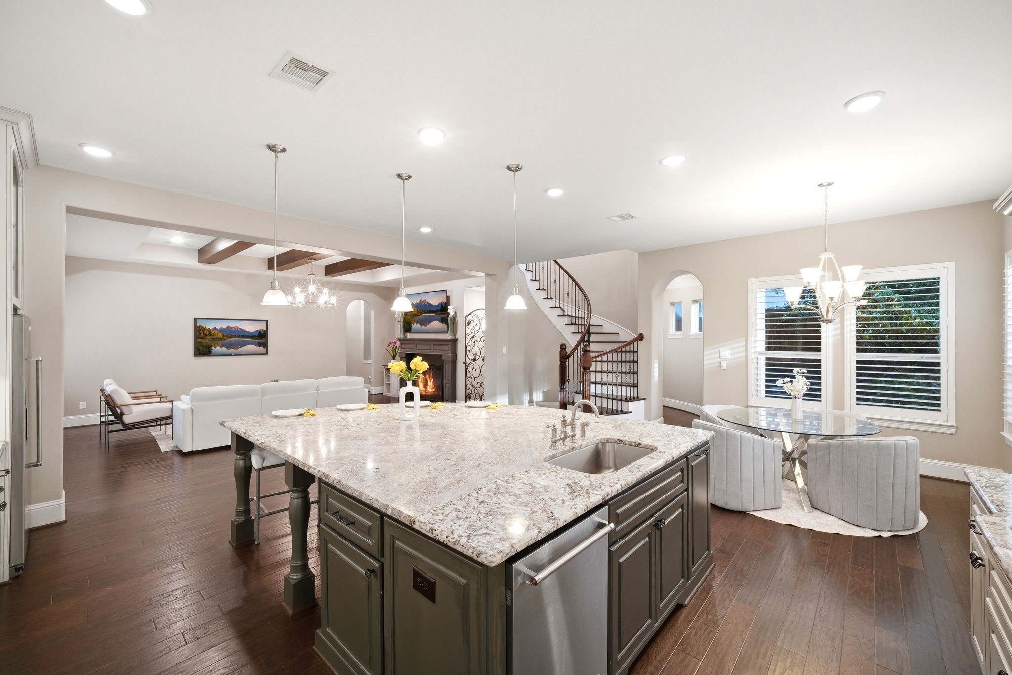 5815 Stratton Woods Drive Spring, TX 77389 - Photo 23 of 45 a kitchen with granite countertop a center island and a wooden floor