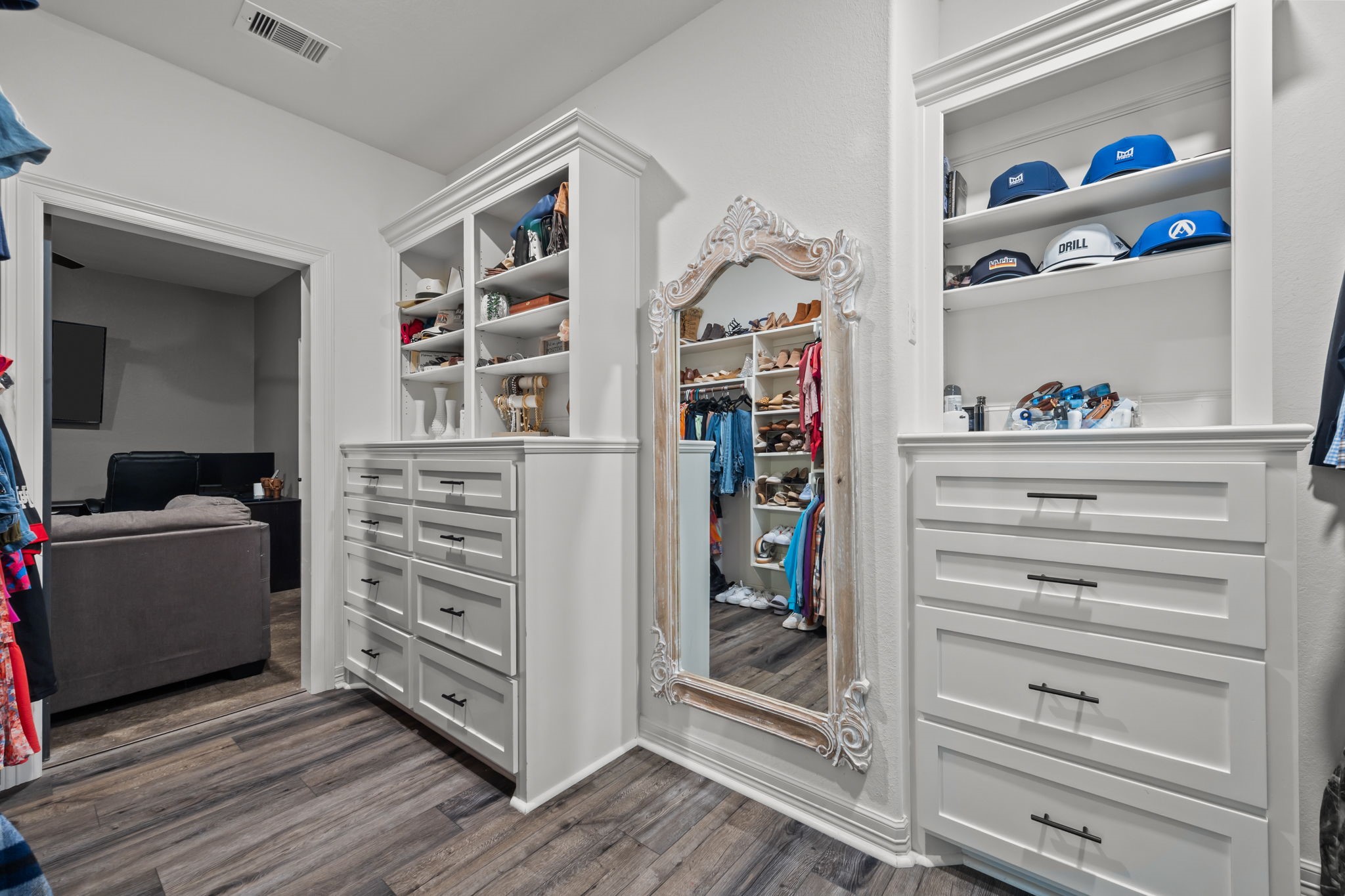 756 Angus Trail Angleton, TX 77515 - Photo 17 of 39 a living room with a bookshelf and a wooden floor