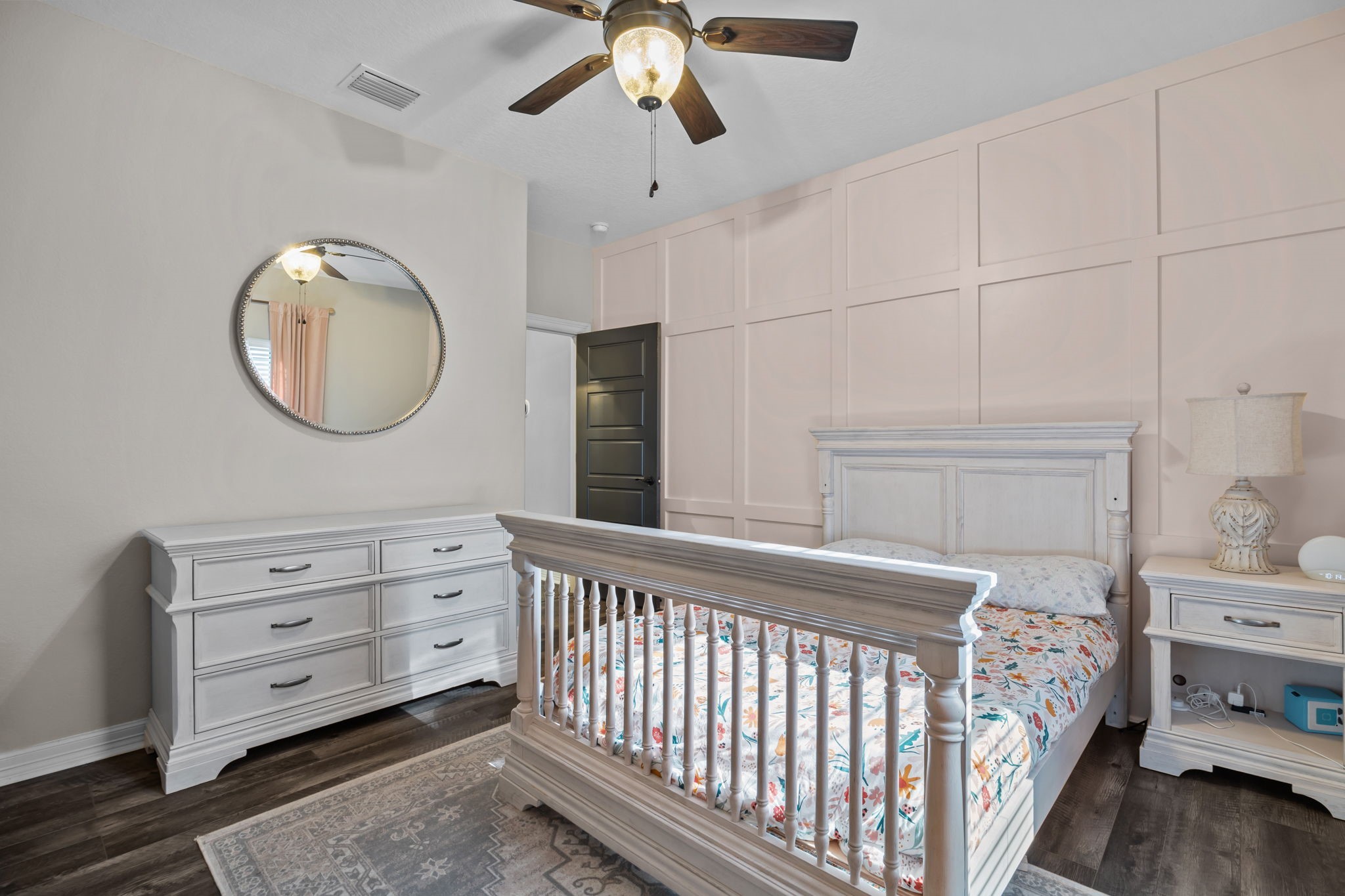 756 Angus Trail Angleton, TX 77515 - Photo 20 of 39 a bedroom with a bed and a chandelier