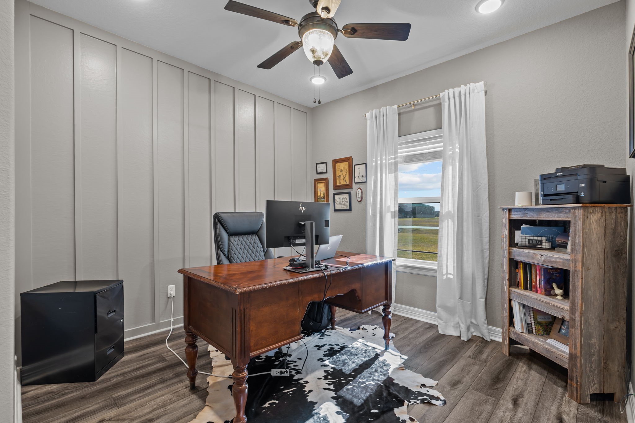 756 Angus Trail Angleton, TX 77515 - Photo 22 of 39 a view of a workspace with furniture and a window