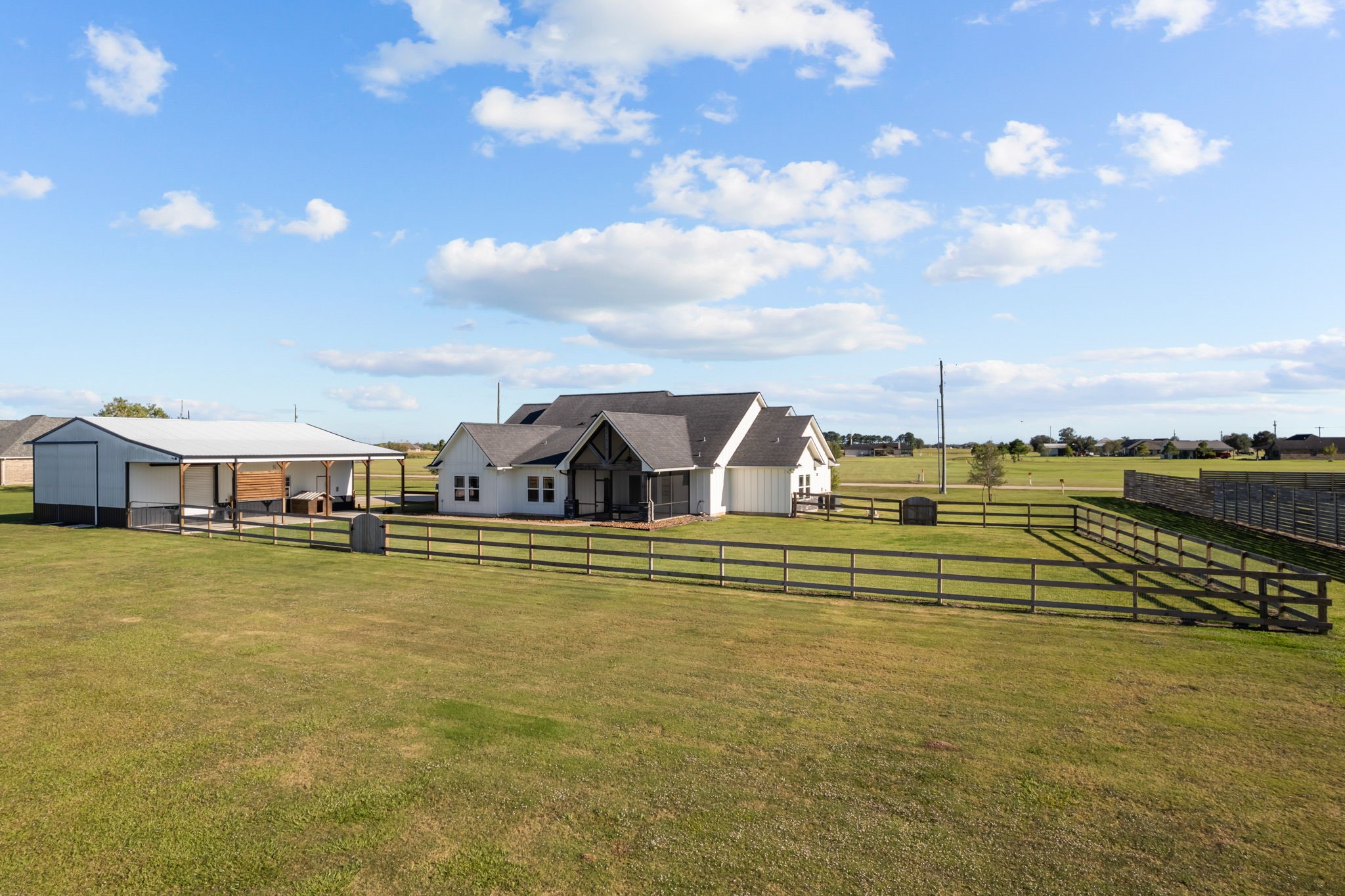 756 Angus Trail Angleton, TX 77515 - Photo 31 of 39 a view of a lake with houses
