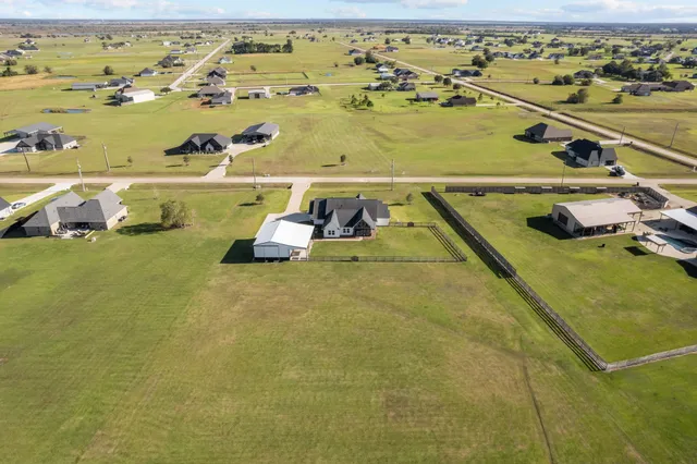 an aerial view of a house with a outdoor space