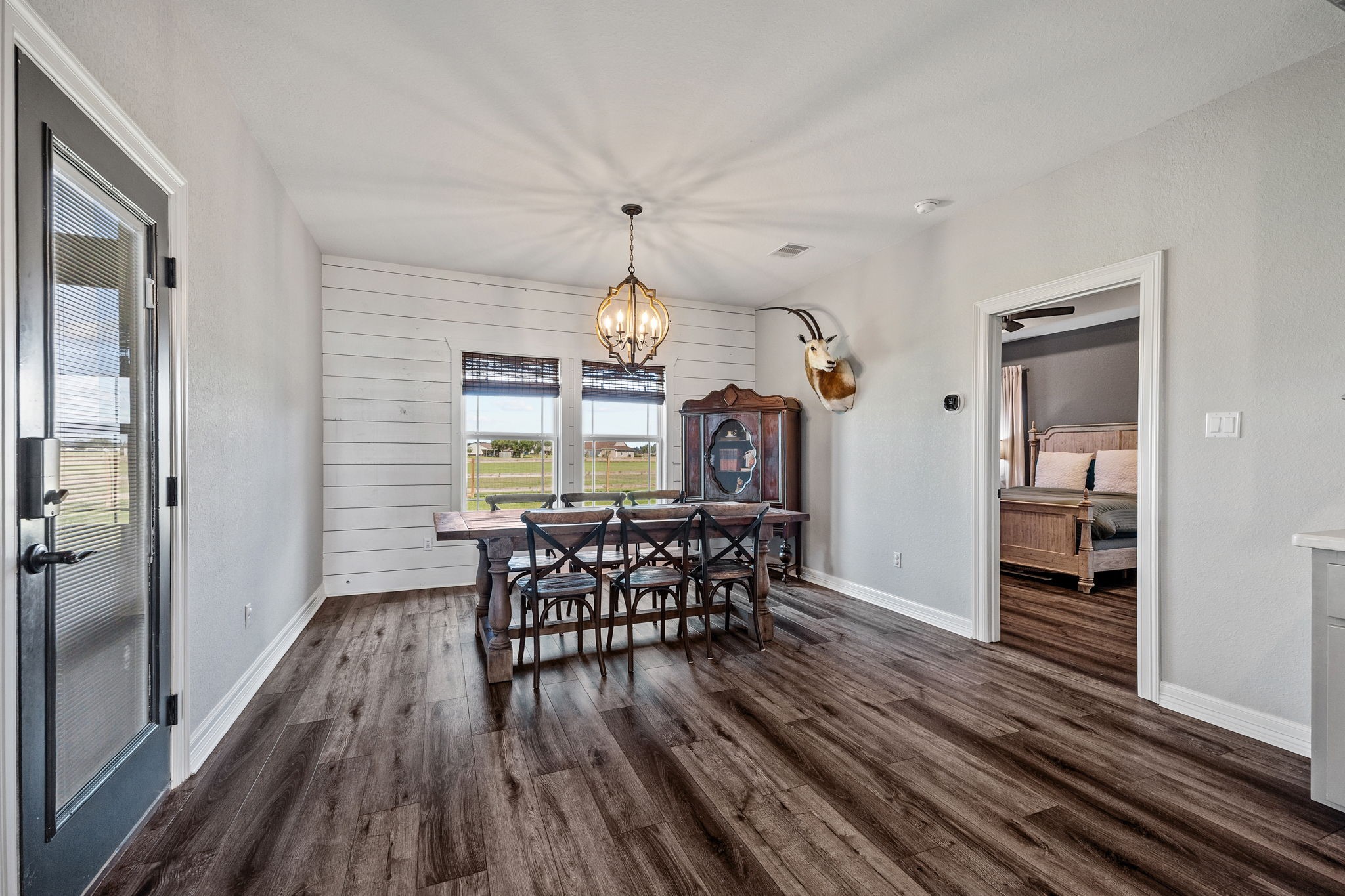 756 Angus Trail Angleton, TX 77515 - Photo 35 of 39 a view of a dining room with furniture window and wooden floor