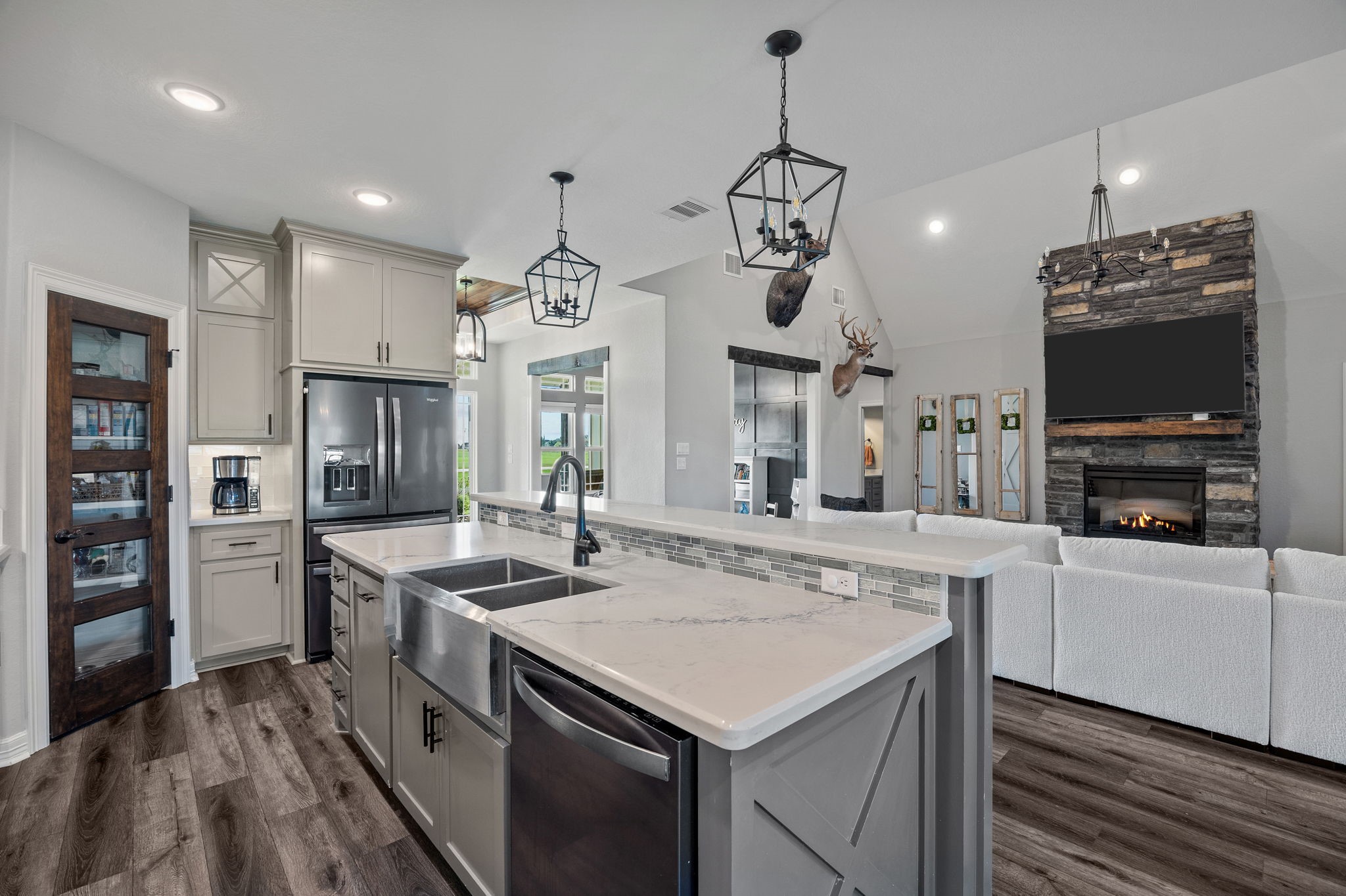 756 Angus Trail Angleton, TX 77515 - Photo 6 of 39 a kitchen with stainless steel appliances granite countertop a sink and a stove