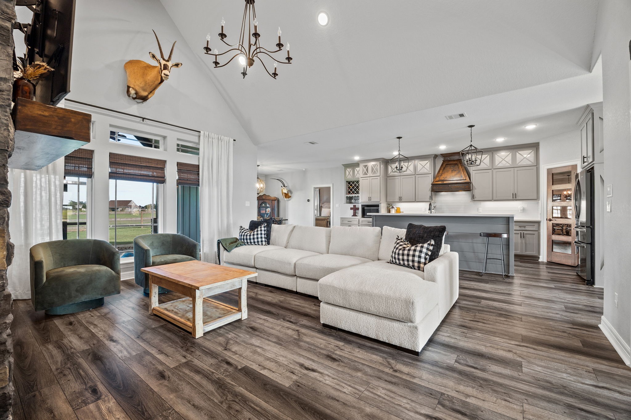 756 Angus Trail Angleton, TX 77515 - Photo 9 of 39 a living room with furniture and a chandelier