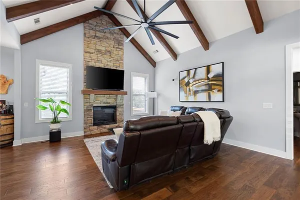 a living room with furniture and a fireplace