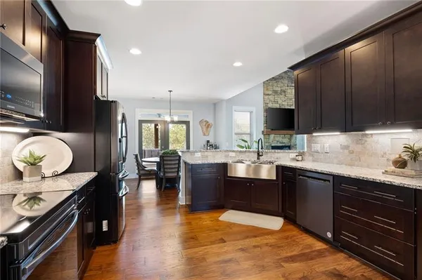 a kitchen with wooden cabinets and sink