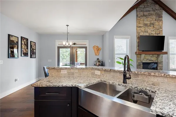 a kitchen with a sink and a fireplace