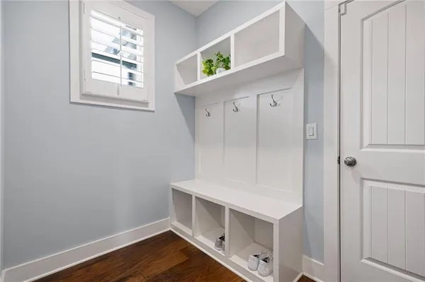 a view of an entryway with wooden floor