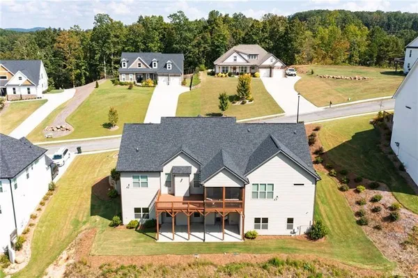 an aerial view of a house with a swimming pool