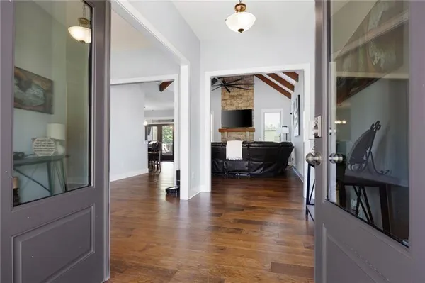 a view of living room with furniture and wooden floor