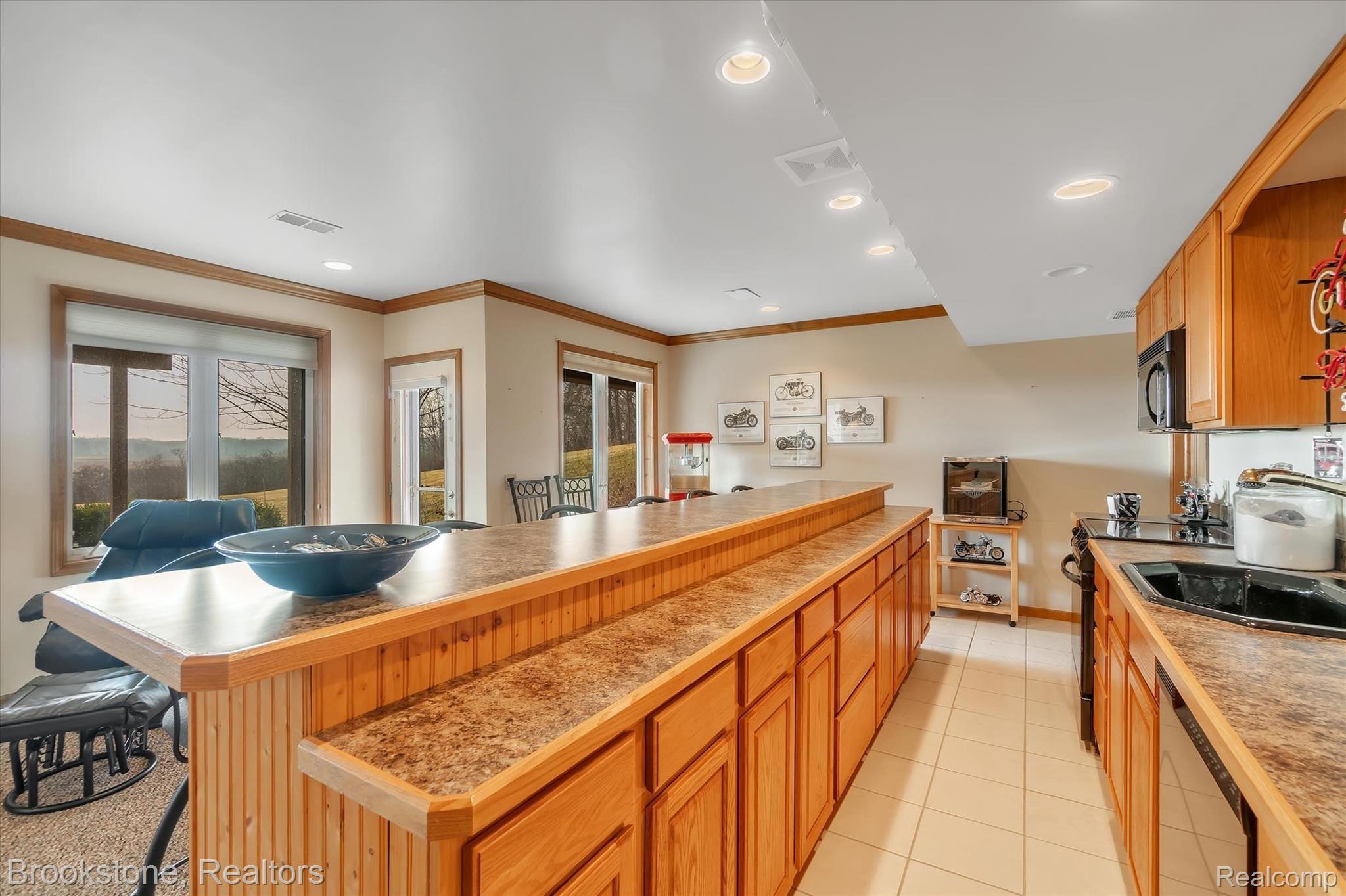 7474 Bennett Lake Road Fenton, MI 48430 - Photo 24 of 40 Lower level kitchen area with dishwasher & range!