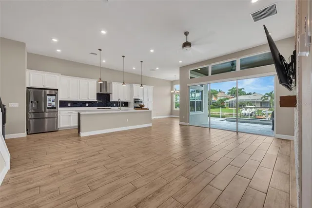 a view of kitchen with cabinets and wooden floor