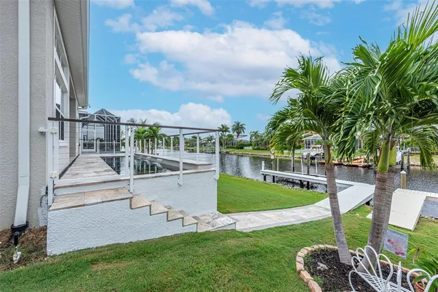 a view of a swimming pool with a garden and plants