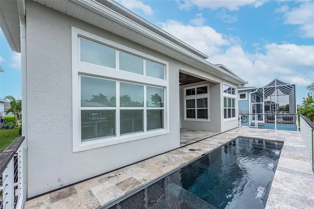 a view of a swimming pool with a lounge chair