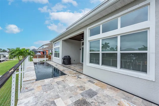a view of a swimming pool with a patio