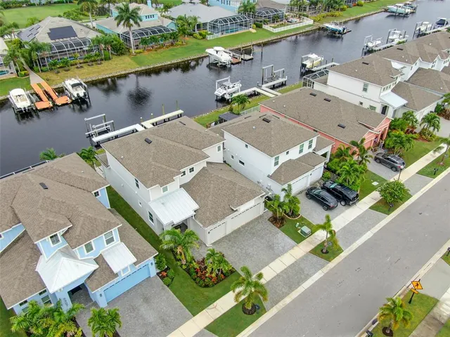 an aerial view of a pool with chairs