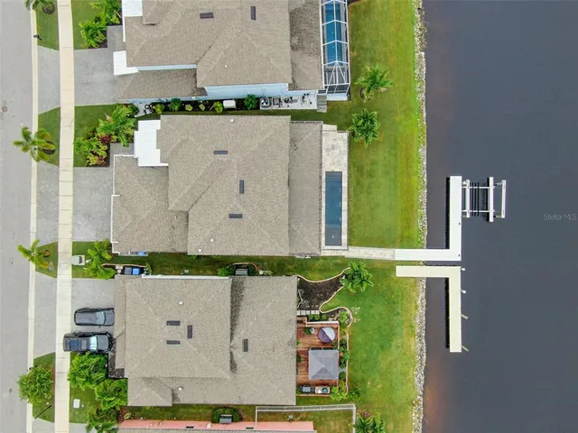 an aerial view of residential building and parking space