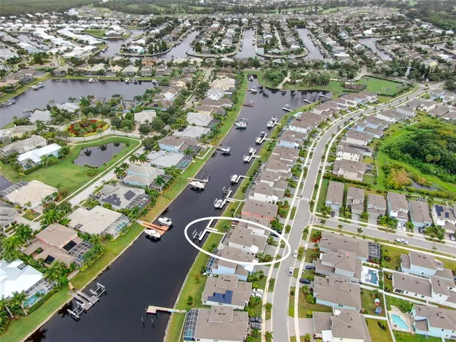 an aerial view of a house with a lake view