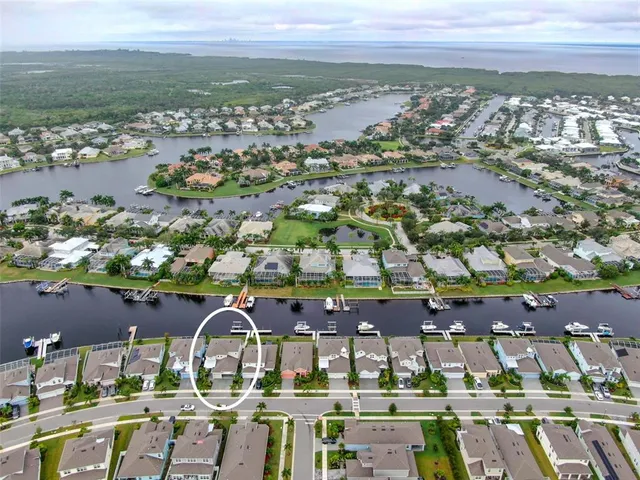 an aerial view of a house with a lake view