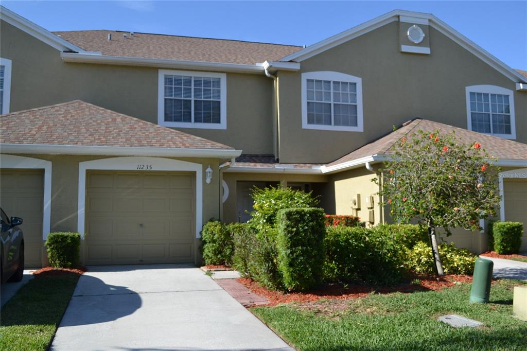 11235 Kapok Grand Circle Madeira Beach, FL 33708 - Photo 32 of 34 front view of a house