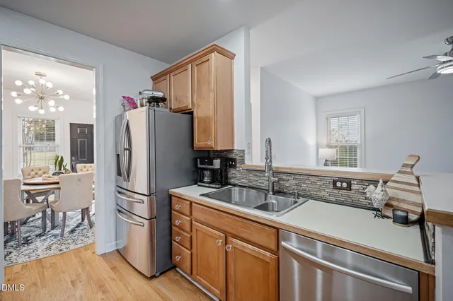 a kitchen with a refrigerator and a sink