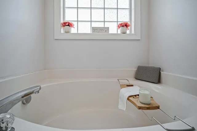 a bathroom with a bathtub and shower