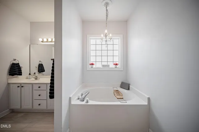 a bathroom with a sink and a window
