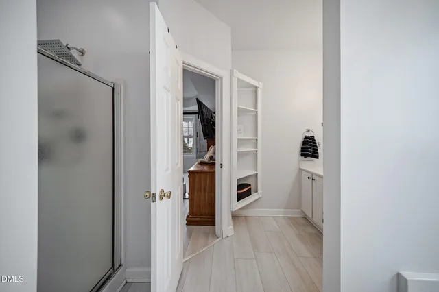 a en suite bathroom with a sink double vanity and a mirror
