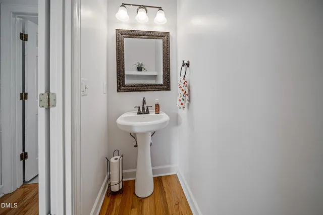 a white toilet sitting next to a shower