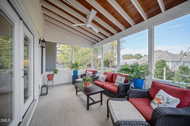 a view of a house with a yard porch and sitting area