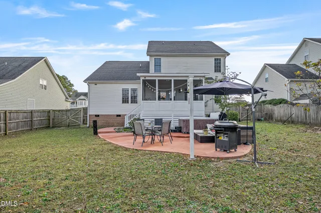 a front view of a house with yard and porch
