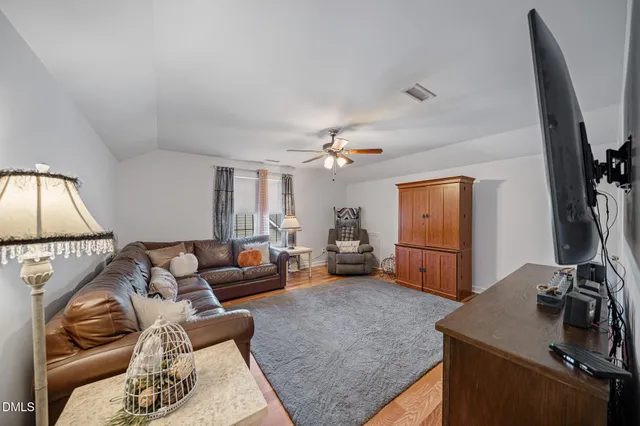 a view of room with wooden floor