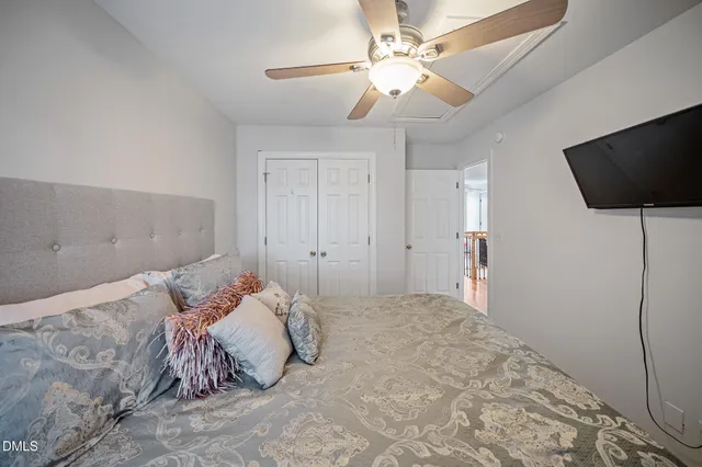 a bedroom with furniture and a fireplace