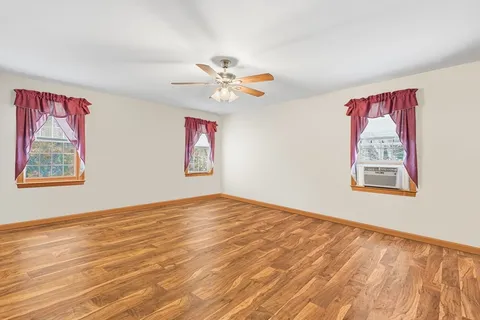 a front view of a house with a yard and a garage