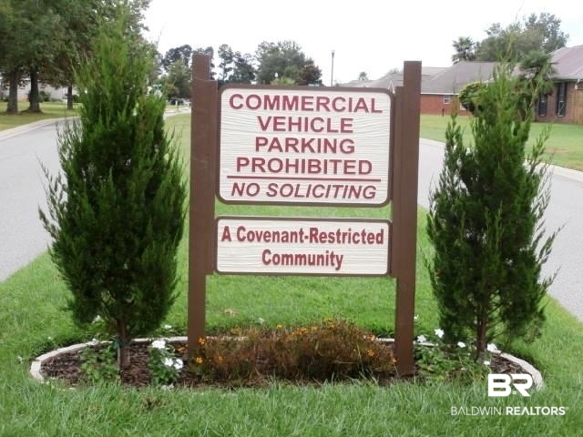 16976 Sugar Loop Foley, AL 36535 - Photo 16 of 16 Community sign with a yard