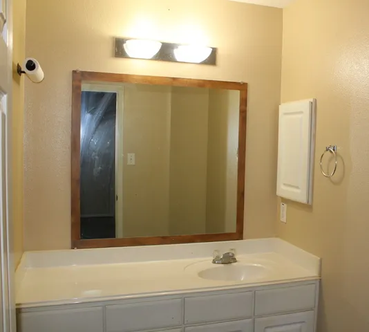 a bathroom with a bathtub and a sink