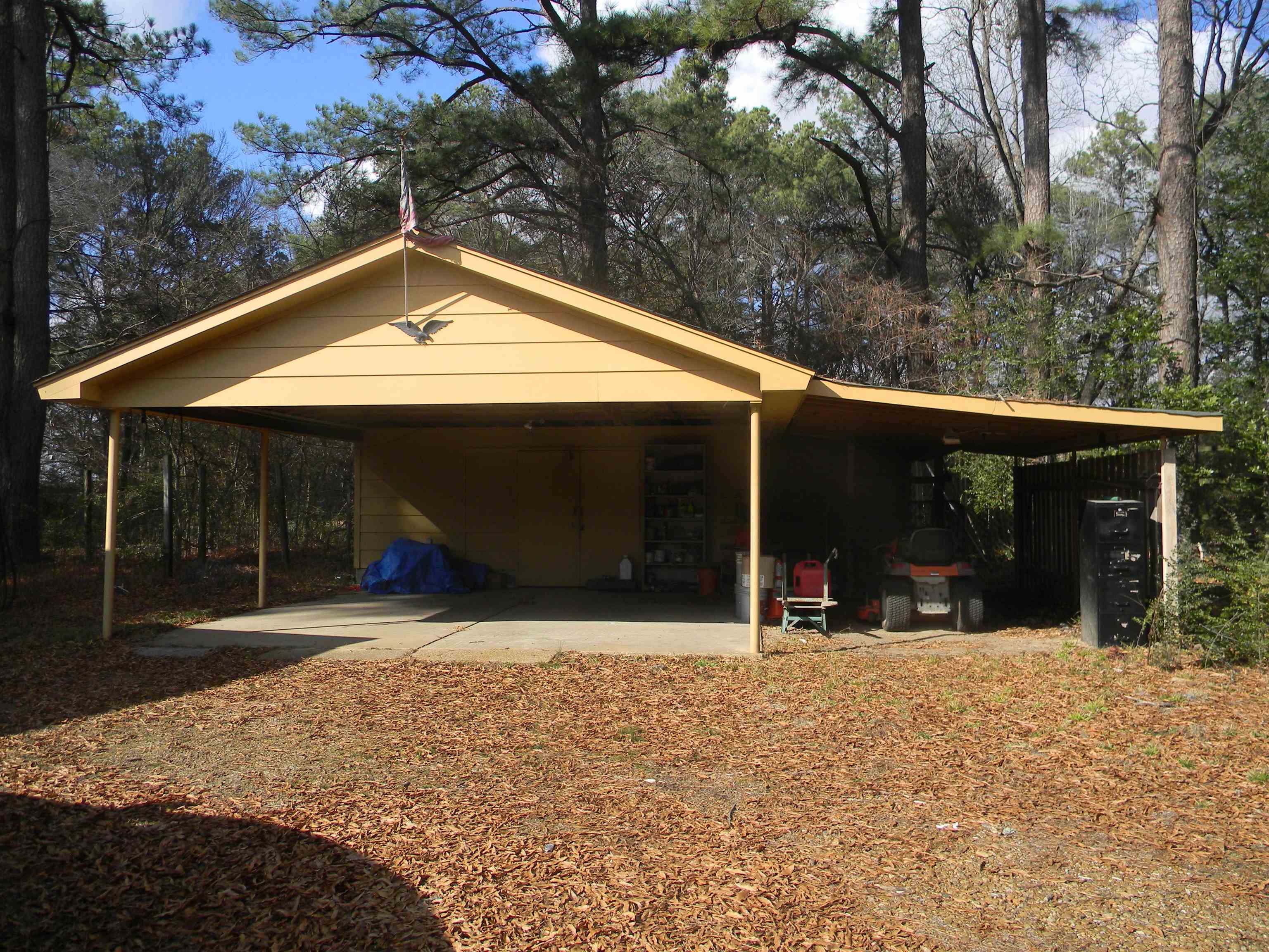 5558 Crestview Road Memphis, TN 38134 - Photo 11 of 32 a view of a house with floor to ceiling windows and a yard