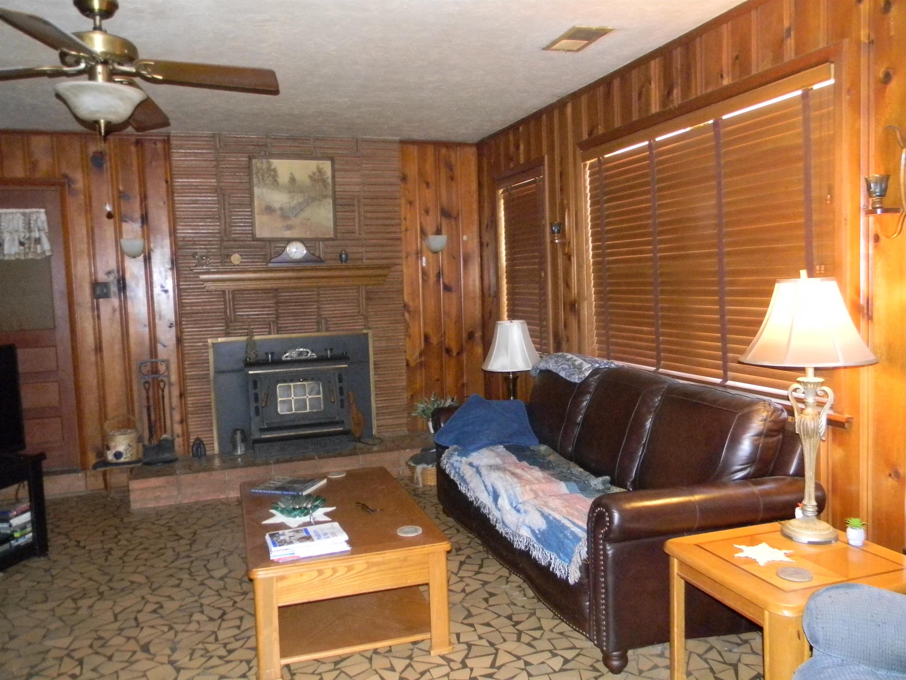 5558 Crestview Road Memphis, TN 38134 - Photo 18 of 32 a living room with furniture and a fireplace