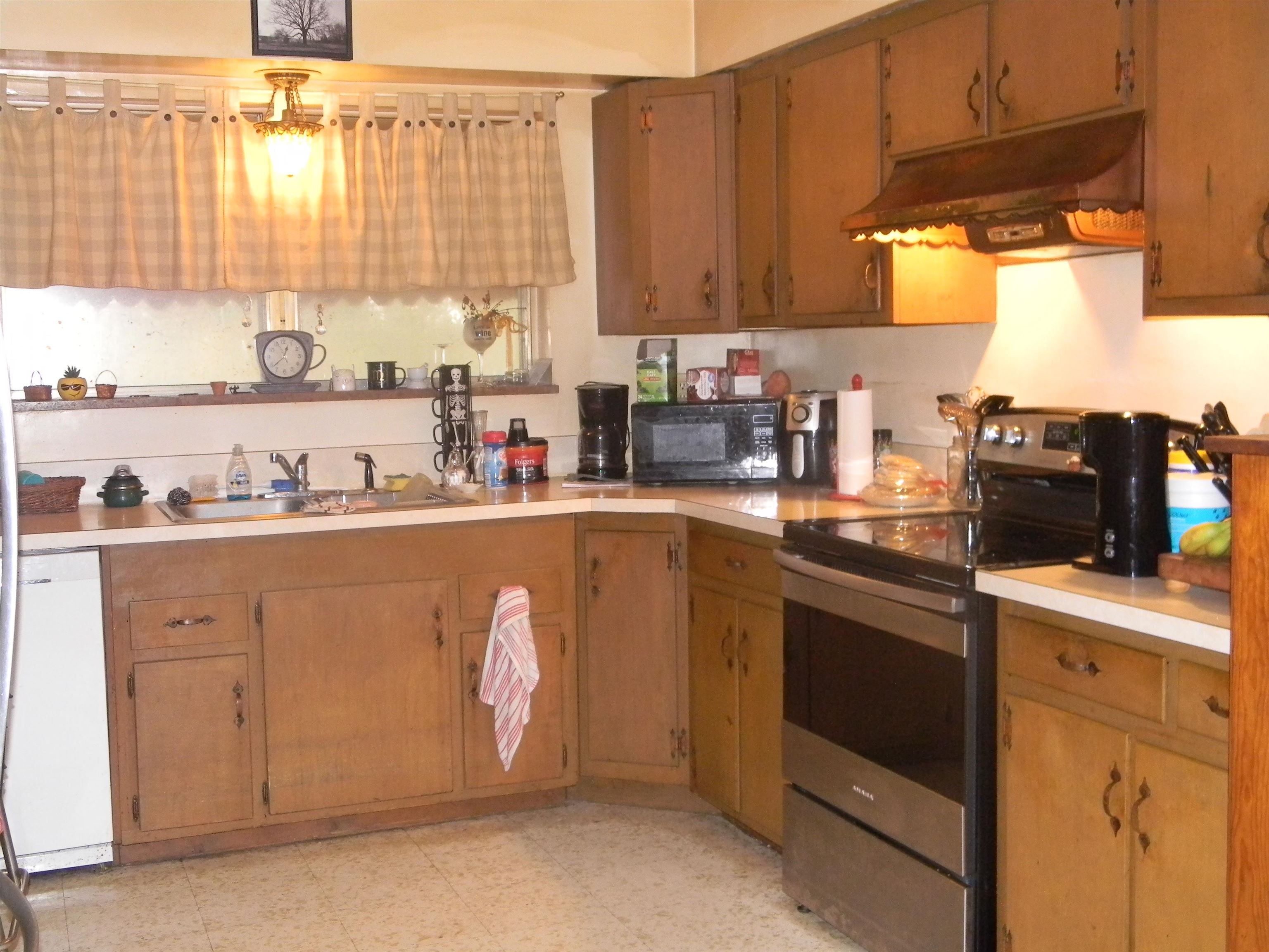 5558 Crestview Road Memphis, TN 38134 - Photo 21 of 32 a kitchen with a sink cabinets and window