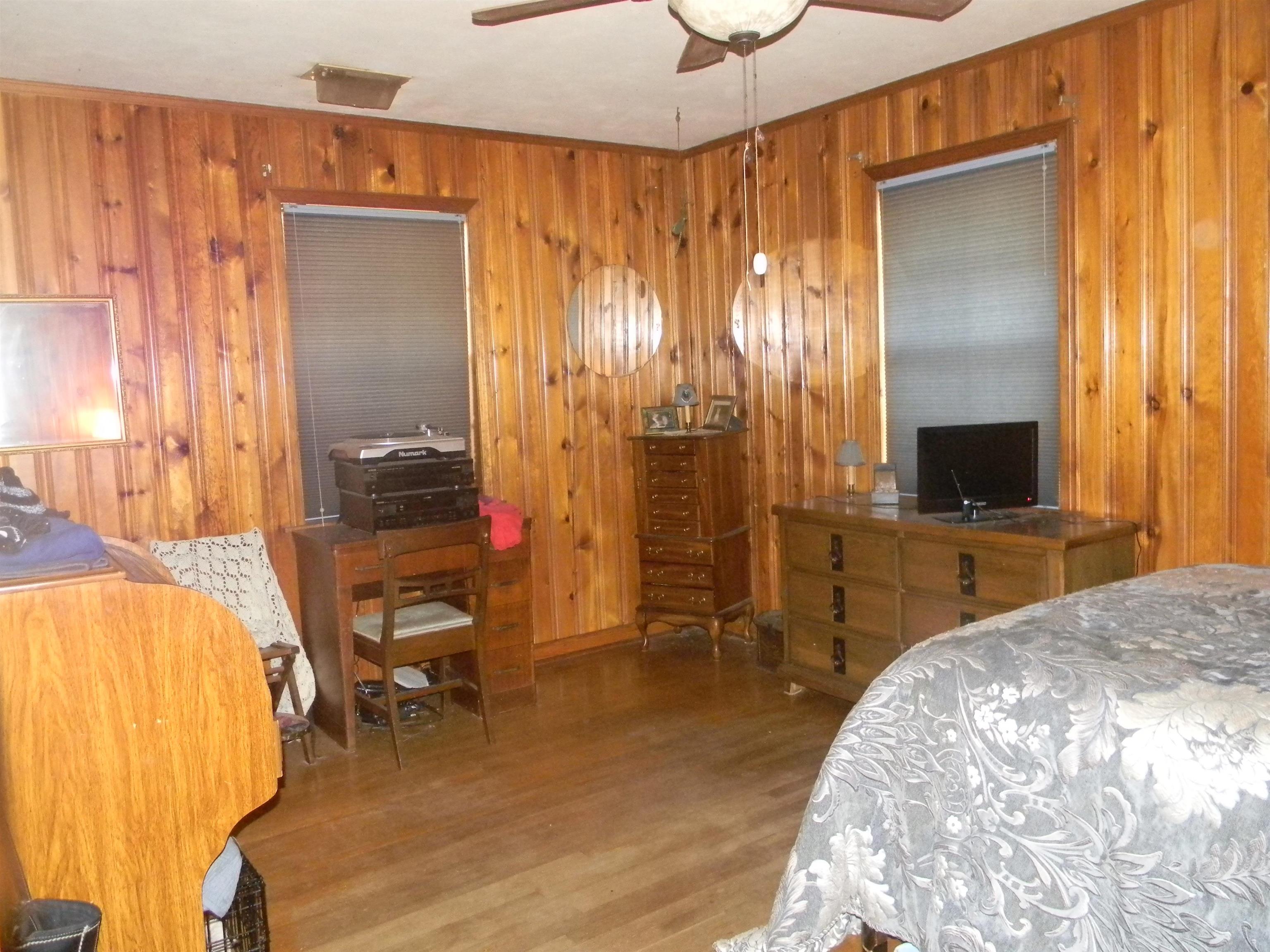 5558 Crestview Road Memphis, TN 38134 - Photo 31 of 32 a bedroom with a bed and a chandelier