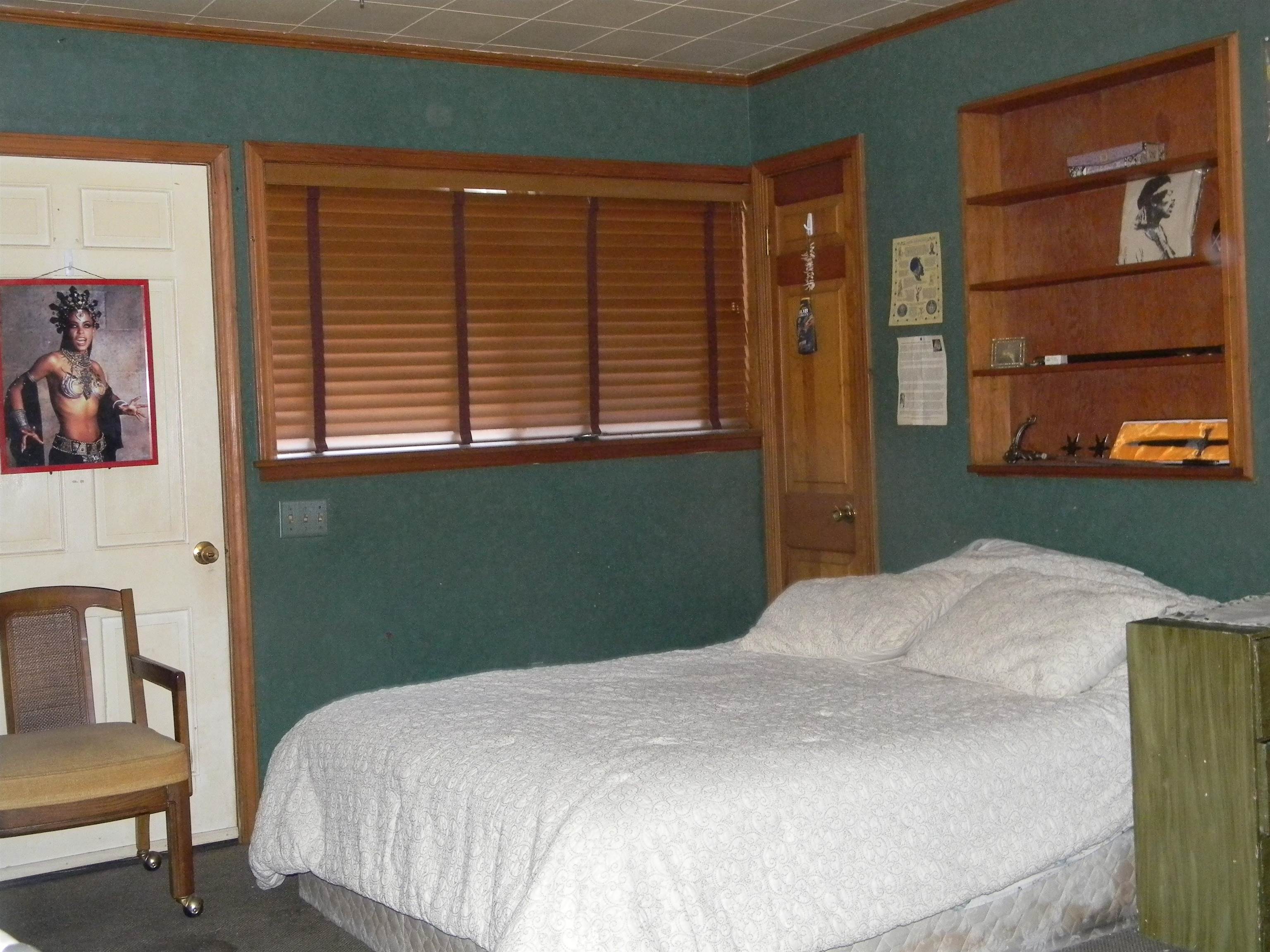 5558 Crestview Road Memphis, TN 38134 - Photo 32 of 32 a bedroom with a bed and a window